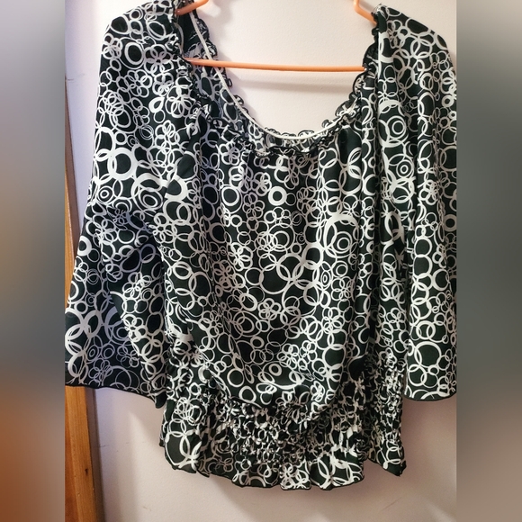 This very pretty blouse and it is a large. - Picture 2 of 3